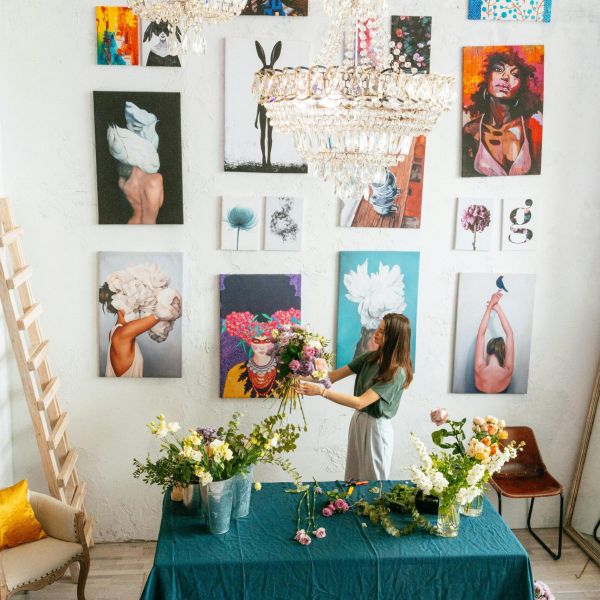 Person in a room with paintings and flowers to signify finding autism assessment.